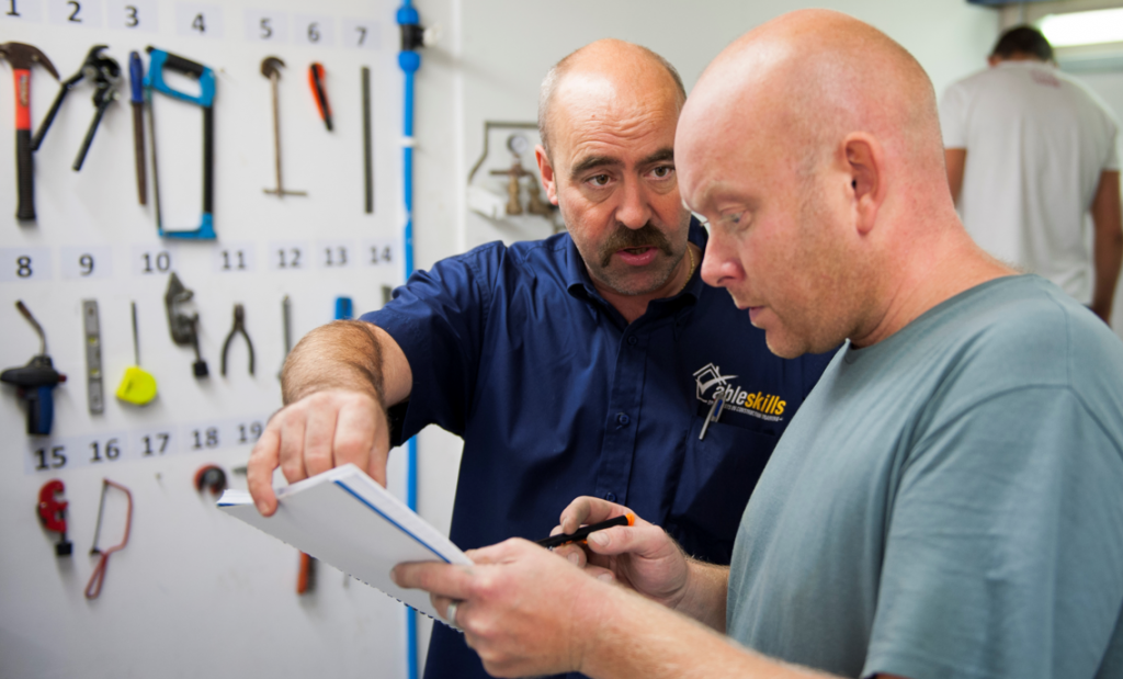 Plumbing student and instructor at Able Skills Construction Training Dartford, Kent