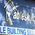 The blue sign for the Able Skills Construction Training Centre