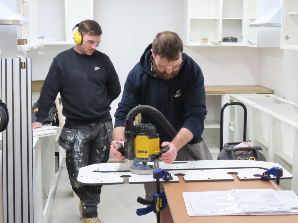 learning how to cut a kitchen worktop during kitchen fitting course