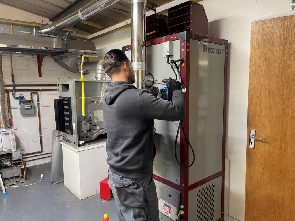 A gas student is working in the commercial gas training centre at Able Skills